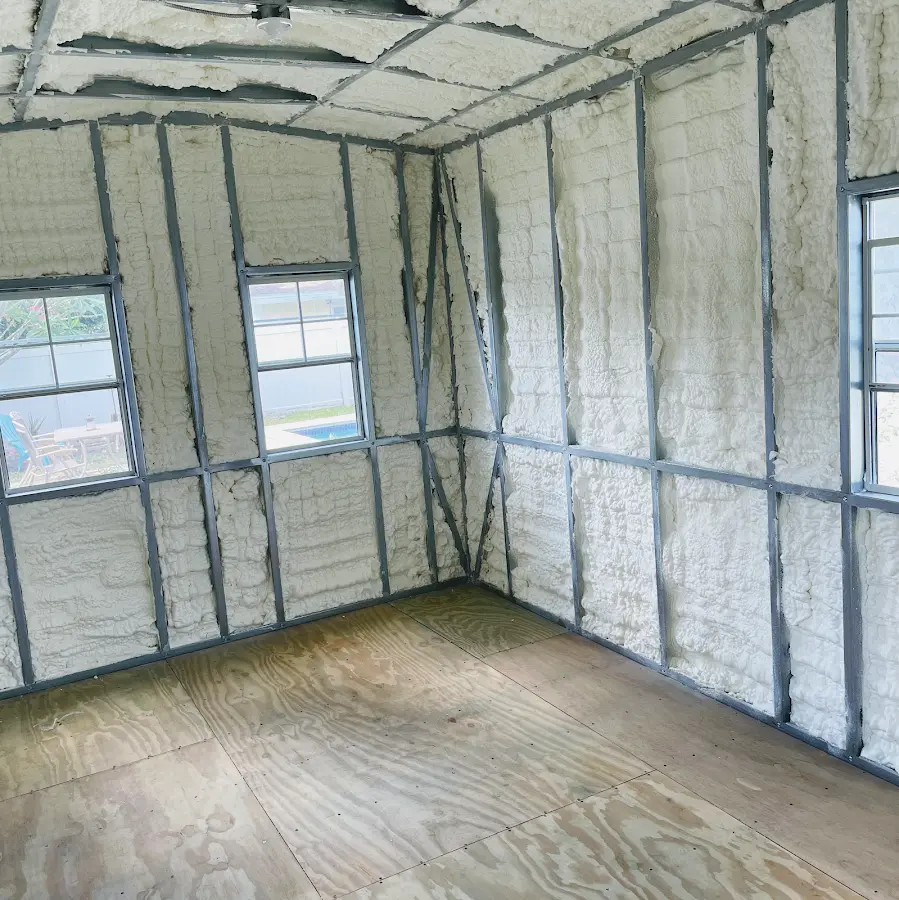 Closed-cell spray foam insulation applied to wall cavities in a residential project in Englewood